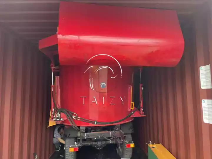 forage mixer spreader loaded into container